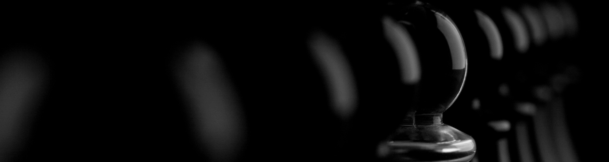 A white pawn that mixes with line of black pawns